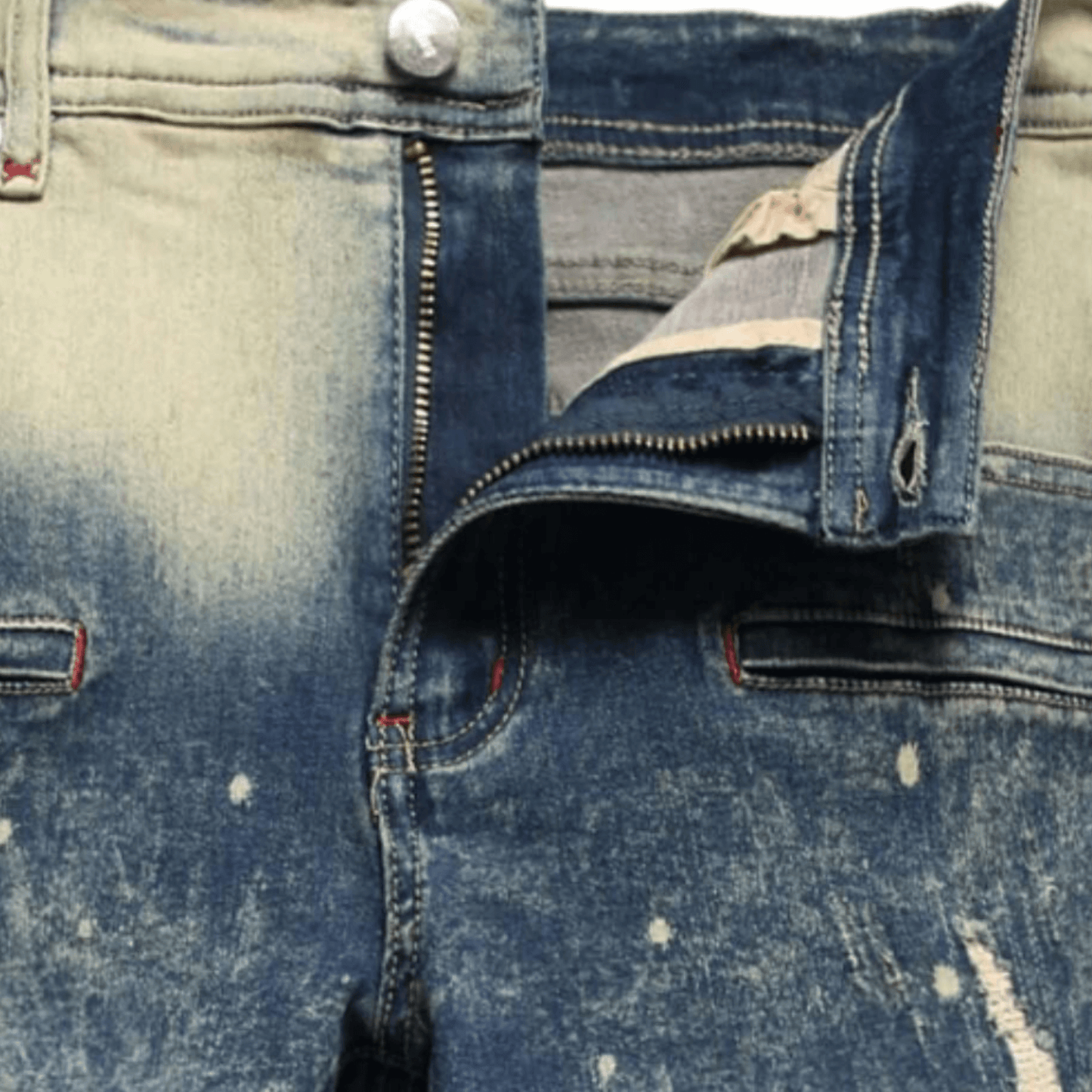 Close-up of men's relaxed-fit acid wash denim jeans featuring a zipper and button closure, premium fabric for comfort.