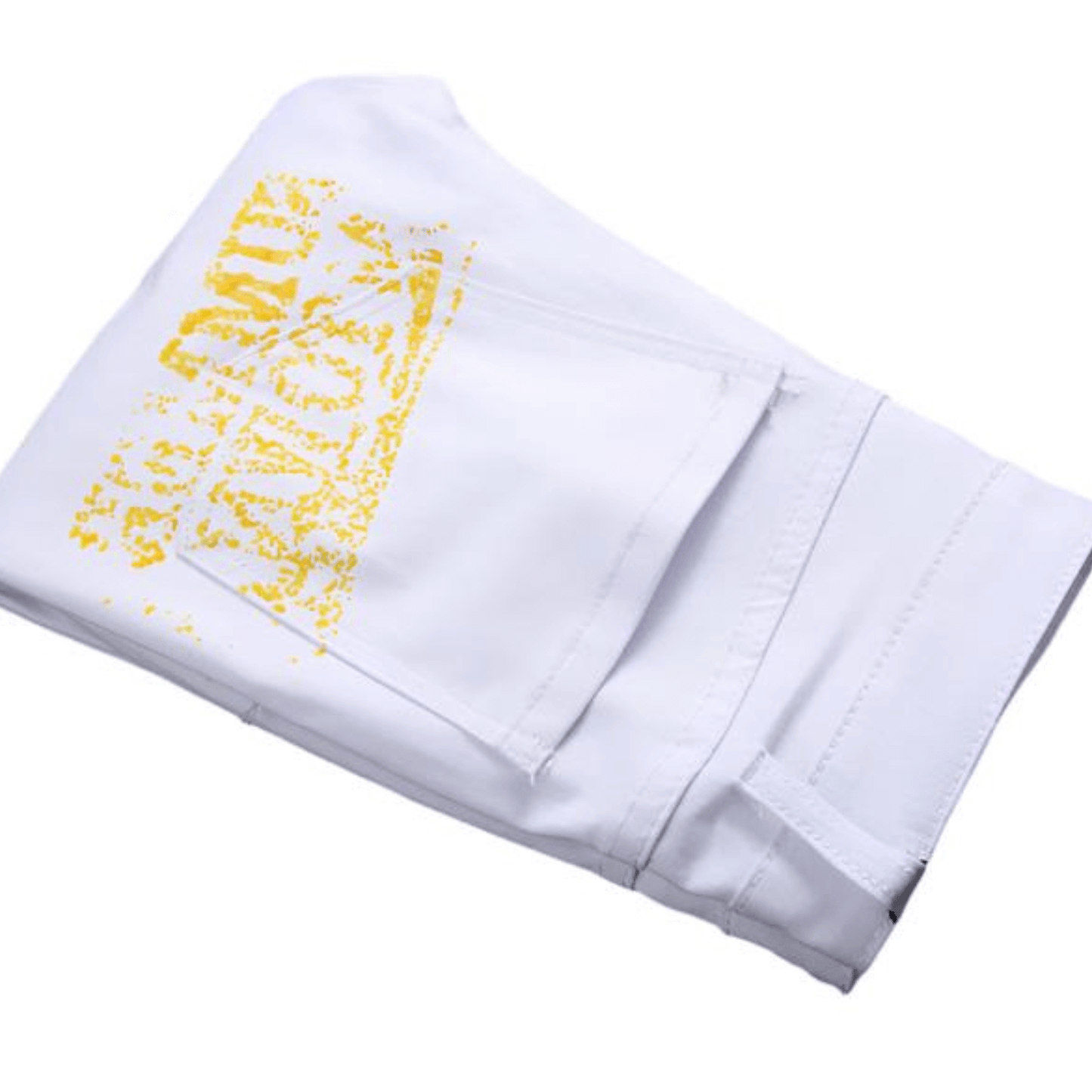 Folded white pants with yellow graphic design, showcasing a comfortable style for casual wear.