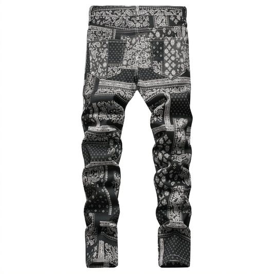 Men's relaxed-fit black paisley print jeans in premium denim for a retro urban style.