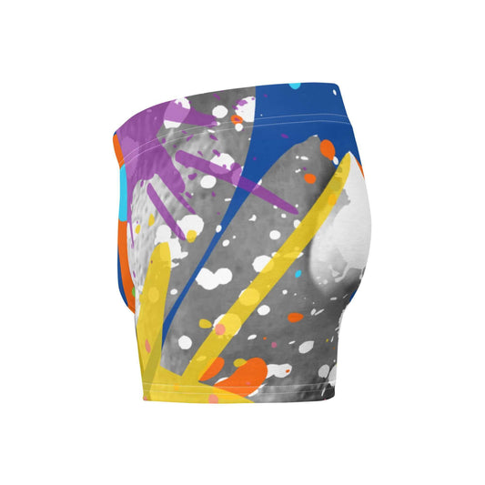 YB Goode Color Drip Boxer Briefs featuring vibrant color splashes on a mid-rise design with a lined front pouch for support.