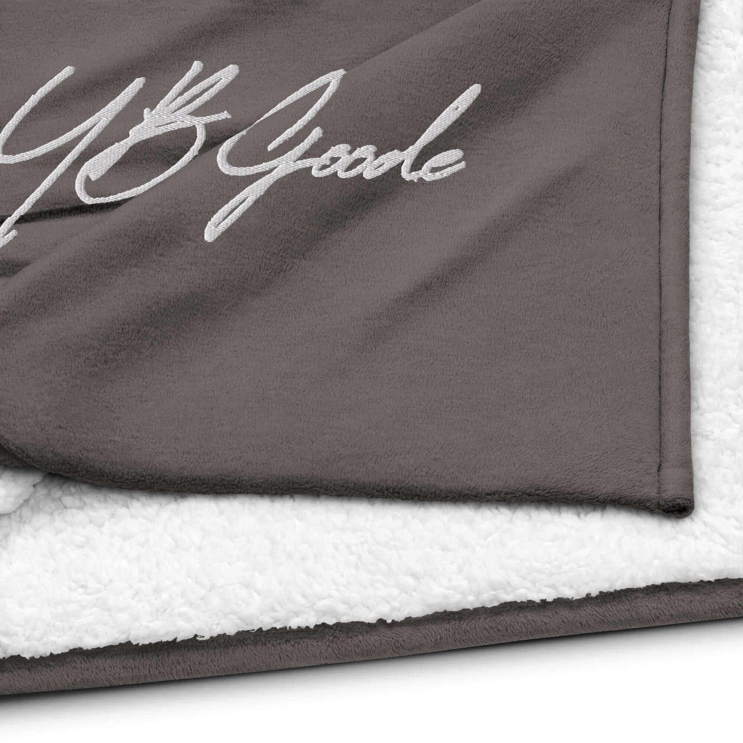 YB Goode signature embroidered sherpa blanket showcasing plush fleece and soft sherpa fabric.