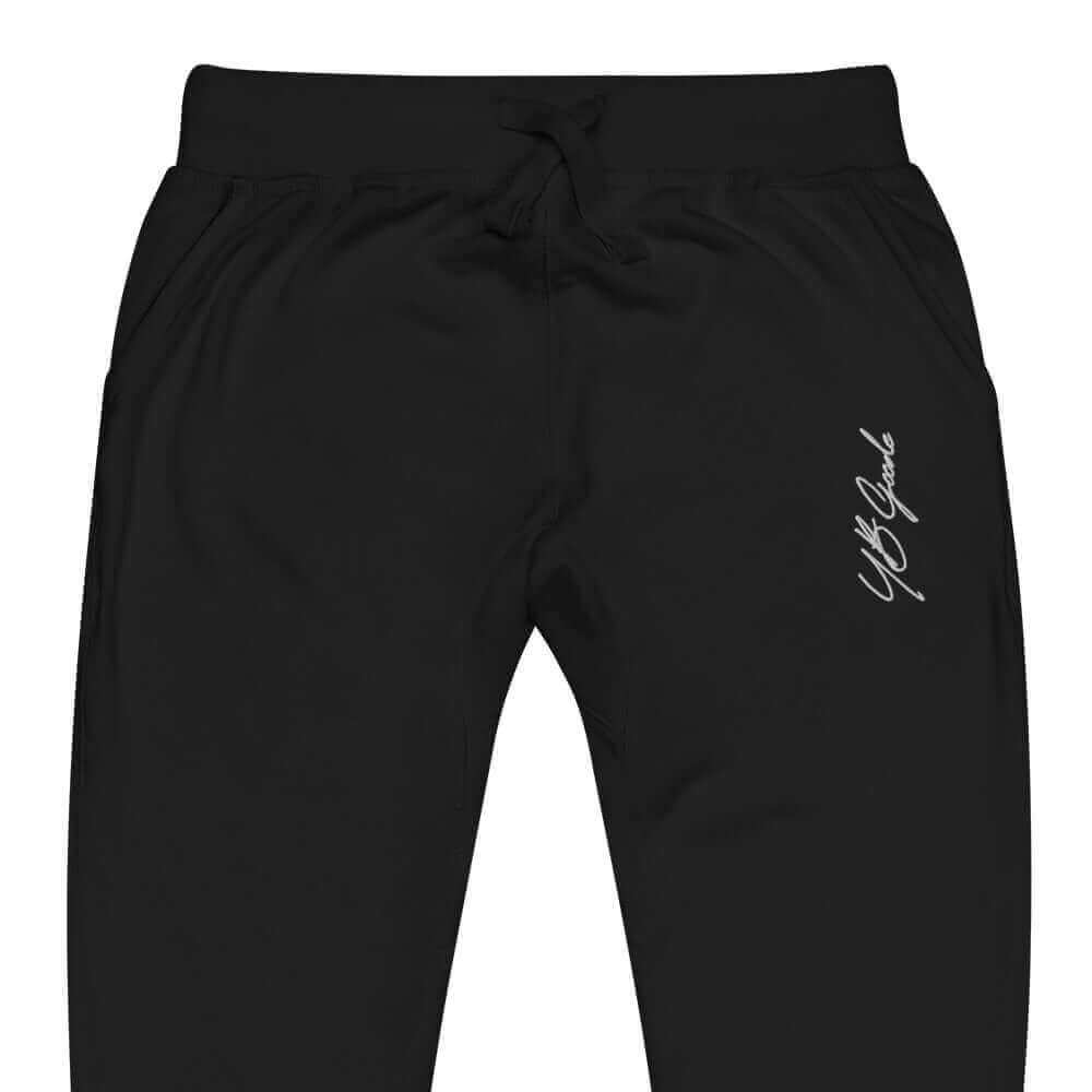 YB Goode embroidered signature sweatpants in black with side pockets and stylish design.