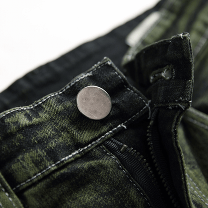 Close-up of the button detail on men's slim-fit green faded designer denim jeans, showcasing premium quality fabric.