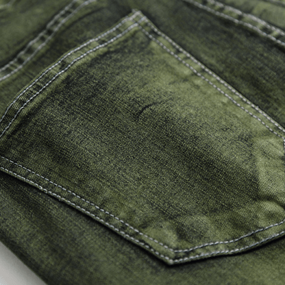 Close-up of men's slim-fit green faded designer denim jeans, showcasing premium quality and machine-washable fabric.