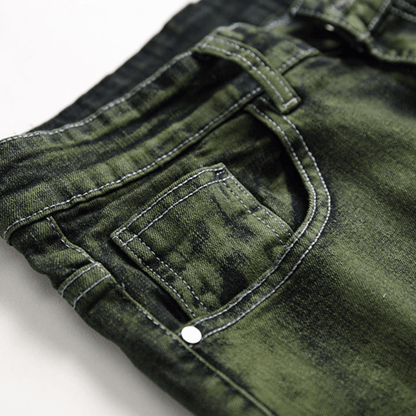 Close-up of men's slim-fit green faded designer denim jeans showcasing premium quality fabric and detailed stitching.