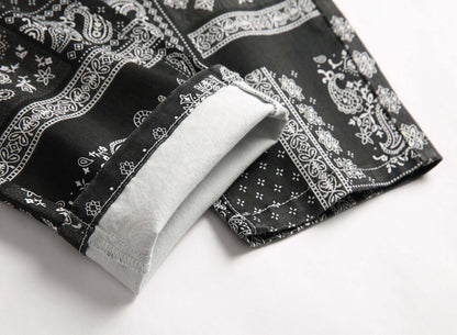 black and white paisley print men's jeans (cuff close-up)